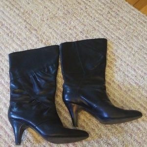 Black, knee high heeled boots. Genuine leather.